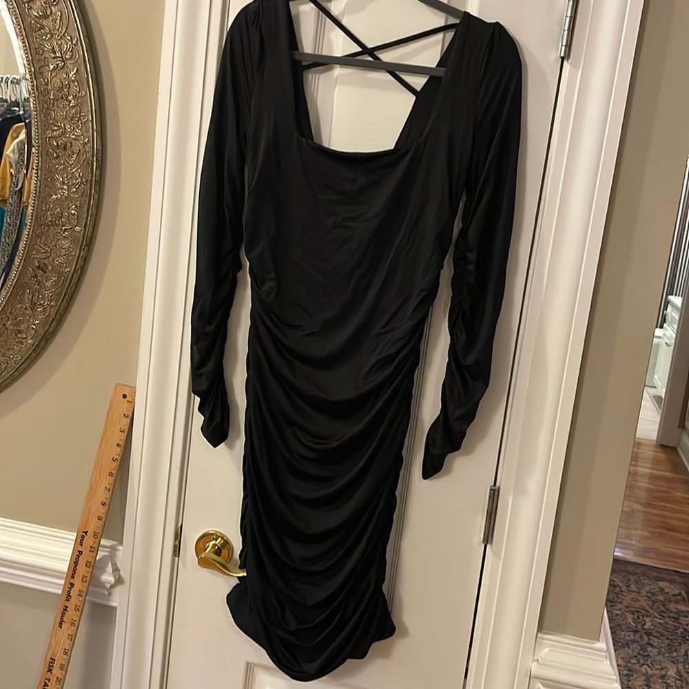 Black Large bodycon style dress with side, black and arm ruched design.